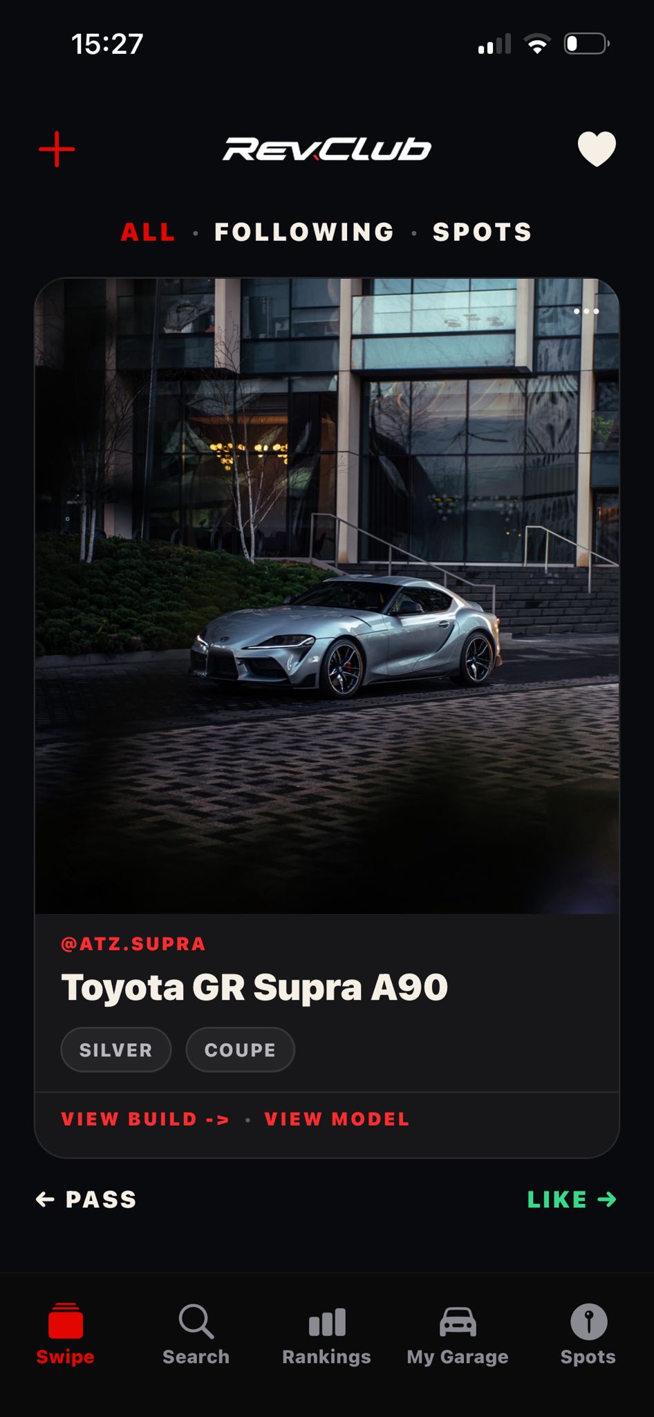 RevClub swipe screen showing a Toyota GR Supra build card with pass and like actions.